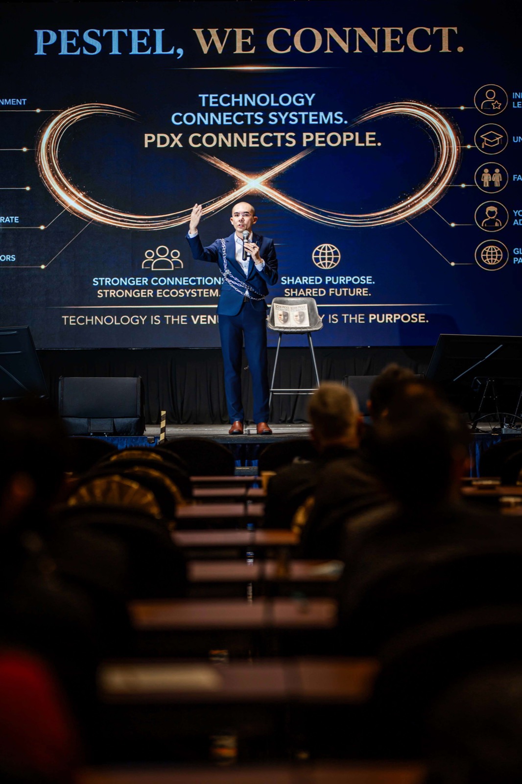 Ts. Lukas J. Tan on stage at PDX2026